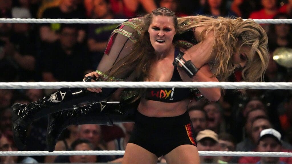 sJul 2, 2022; Las Vegas, NV, USA; Ronda Rousey (black attire) and Natalya (green attire) battle during the Smackdown Women s Championship match at Money In The Bank at MGM Grand Garden Arena.