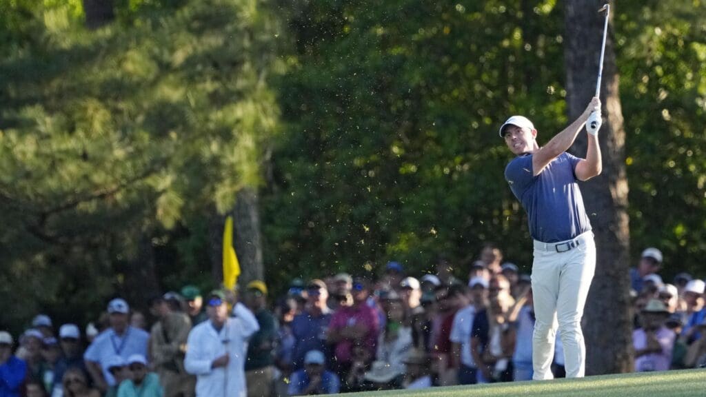 Apr 13, 2025; Augusta, Georgia, USA; Rory McIlroy plays from the fairway on the 18th green during the final round of the Masters Tournament at Augusta National Golf Club.