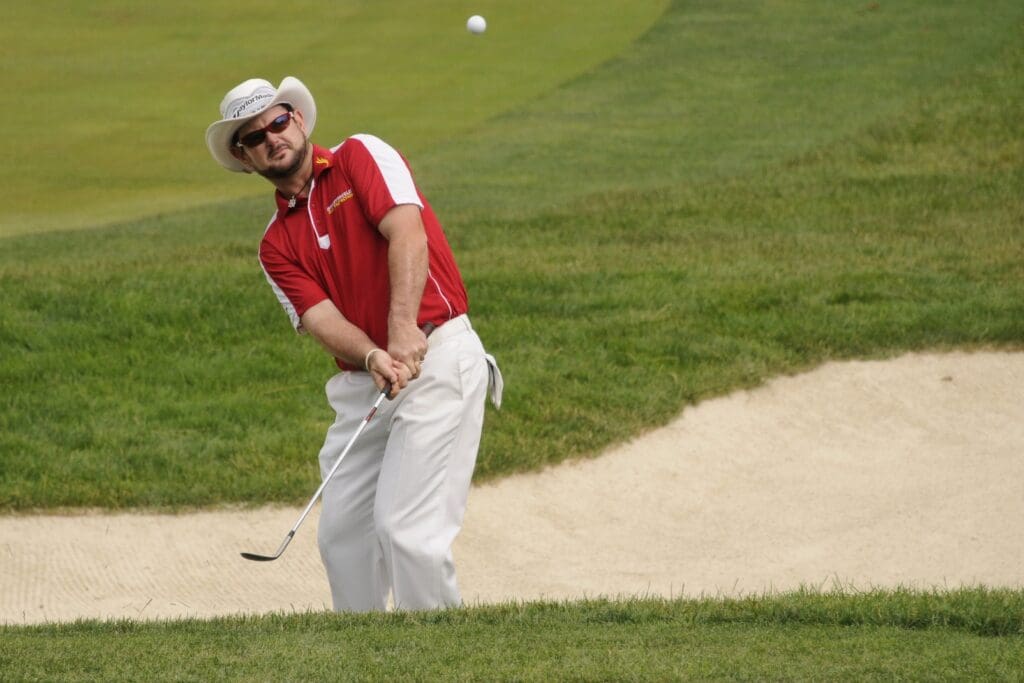 June 16, 2011; Bethesda, MD, USA; Rory Sabbatini hits out of the bunker on the 1st hole during the first round of the 2011 U.S. Open at Congressional Country Club.