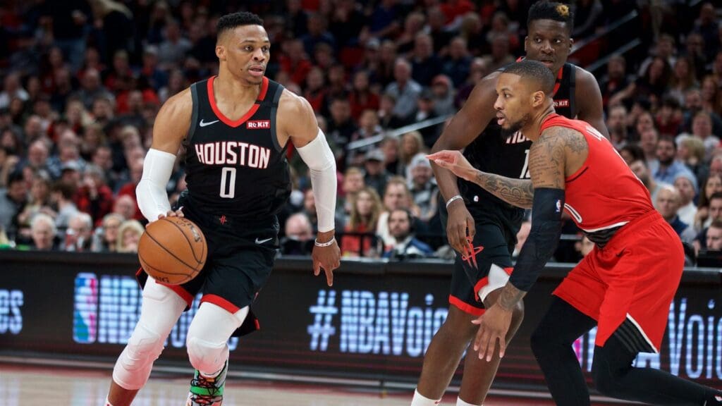 Jan 29, 2020; Portland, OR, USA; Houston Rockets guard Russell Westbrook (0) dribbles past Portland Trail Blazers guard Damian Lillard (0) during the first quarter at the Moda Center.