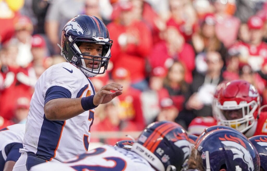 Jan 1, 2023; Kansas City, Missouri, USA; Denver Broncos quarterback Russell Wilson (3) at the line of scrimmage against the Kansas City Chiefs during a game at GEHA Field at Arrowhead Stadium