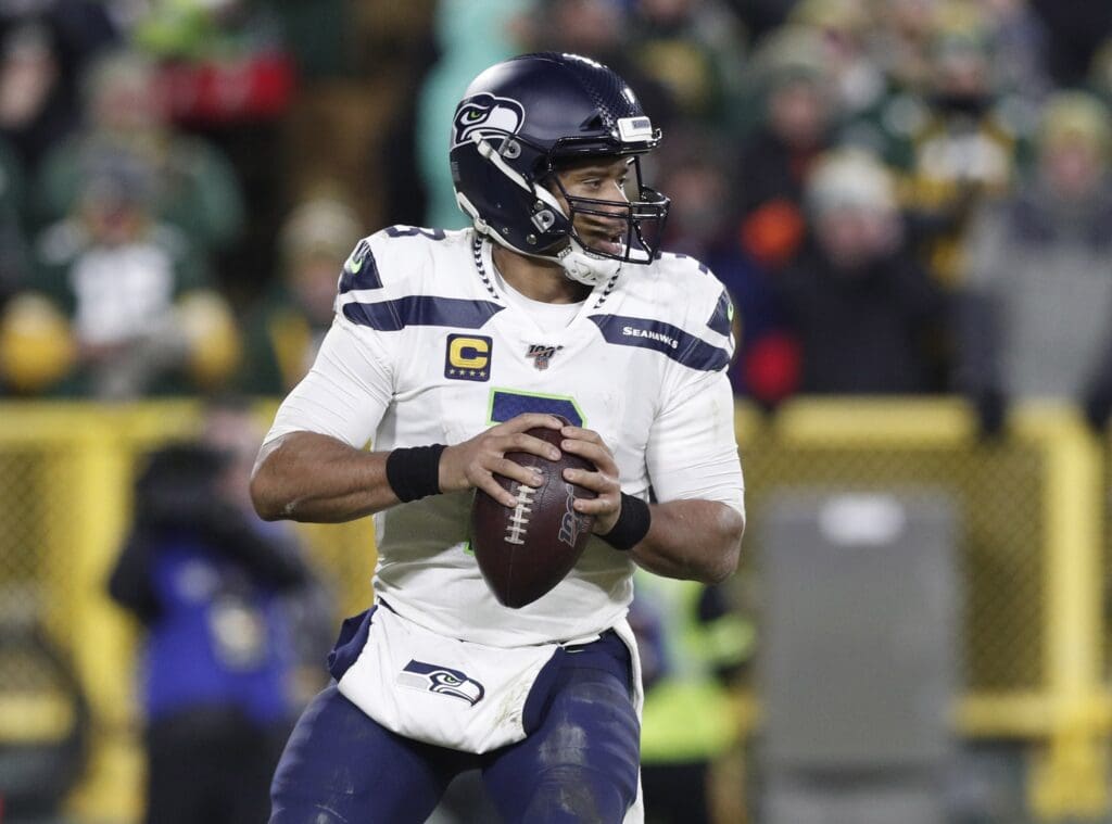 Jan 12, 2020; Green Bay, WI, USA; Seattle Seahawks quarterback Russell Wilson (3) drops back to pass against the Green Bay Packers in the third quarter of a NFC Divisional Round playoff football game at Lambeau Field.