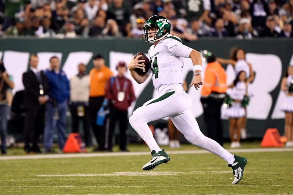 New York Jets quarterback Sam Darnold (14) rushes for a first down in the second half. The New York Jets defeat the Dallas Cowboys, 24-22, on Sunday, Oct. 13, 2019, in East Rutherford. Nyj Vs Dal
