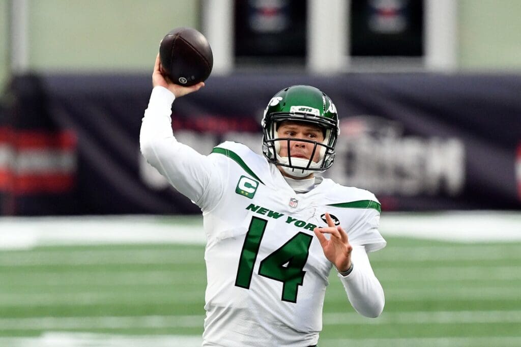 Jan 3, 2021; Foxborough, Massachusetts, USA; New York Jets quarterback Sam Darnold (14) throws the ball against the New England Patriots during the second quarter at Gillette Stadium.