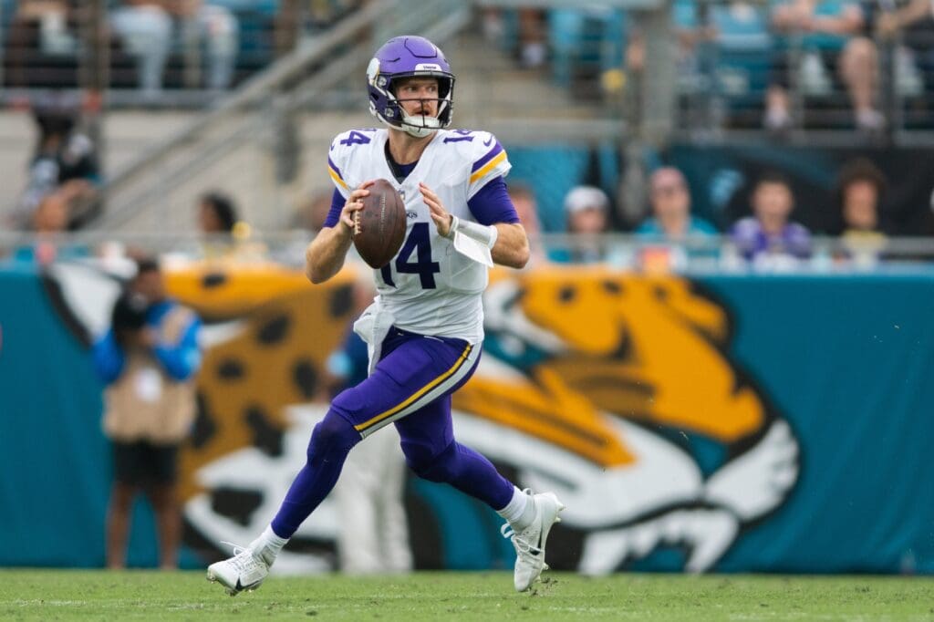 Nov 10, 2024; Jacksonville, Florida, USA; Minnesota Vikings quarterback Sam Darnold (14) runs with the ball against the Jacksonville Jaguars in the third quarter at EverBank Stadium.