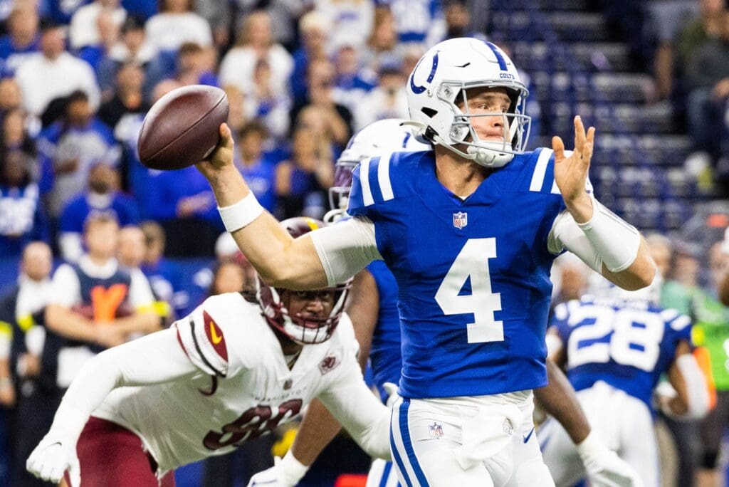 Oct 30, 2022; Indianapolis, Indiana, USA; Indianapolis Colts quarterback Sam Ehlinger (4) drops back to pass the ball in the first quarter against the Washington Commanders at Lucas Oil Stadium.