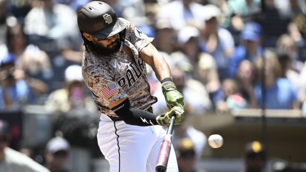Jun 22, 2025; San Diego, California, USA; San Diego Padres outfielder Fernando Tatis Jr. (23) hits a single during the first inning against the Kansas City Royals at Petco Park.