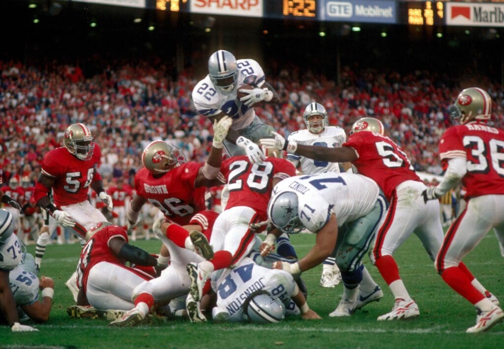 Nov 13, 1994; San Francisco, CA, USA; FILE PHOTO; Dallas Cowboys running back (22) Emmitt Smith goes over the top against the San Francisco 49ers at Candlestick Park. The 49ers defeated the Cowboys 21-14.
