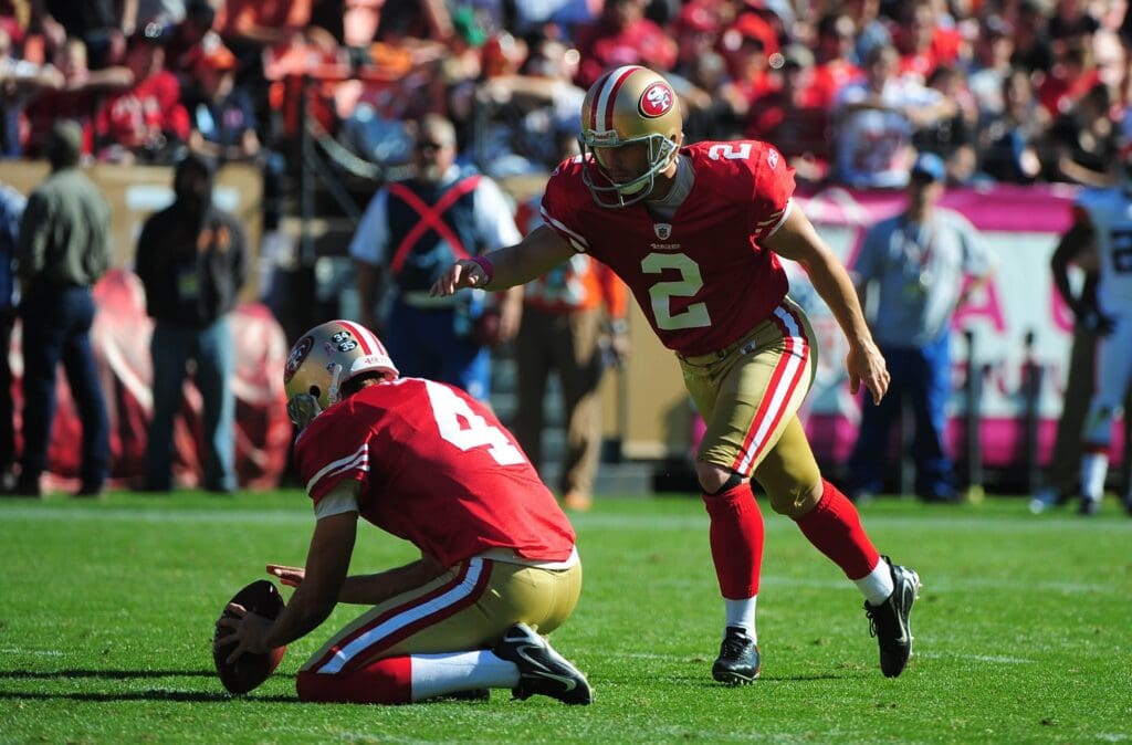 October 30, 2011; San Francisco, CA, USA; San Francisco 49ers kicker David Akers (2) kicks a field goal out of the hold by punter Andy Lee (4) during the first quarter against the Cleveland Browns at Candlestick Park. The 49ers defeated the Browns 20-10.