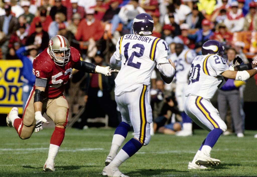 Oct 3, 1993; San Francisco, CA, USA; San Francisco 49ers linebacker Bill Romanowski (53) pressures Minnesota Vikings quarterback Sean Salisbury (12) at Candlestick Park.