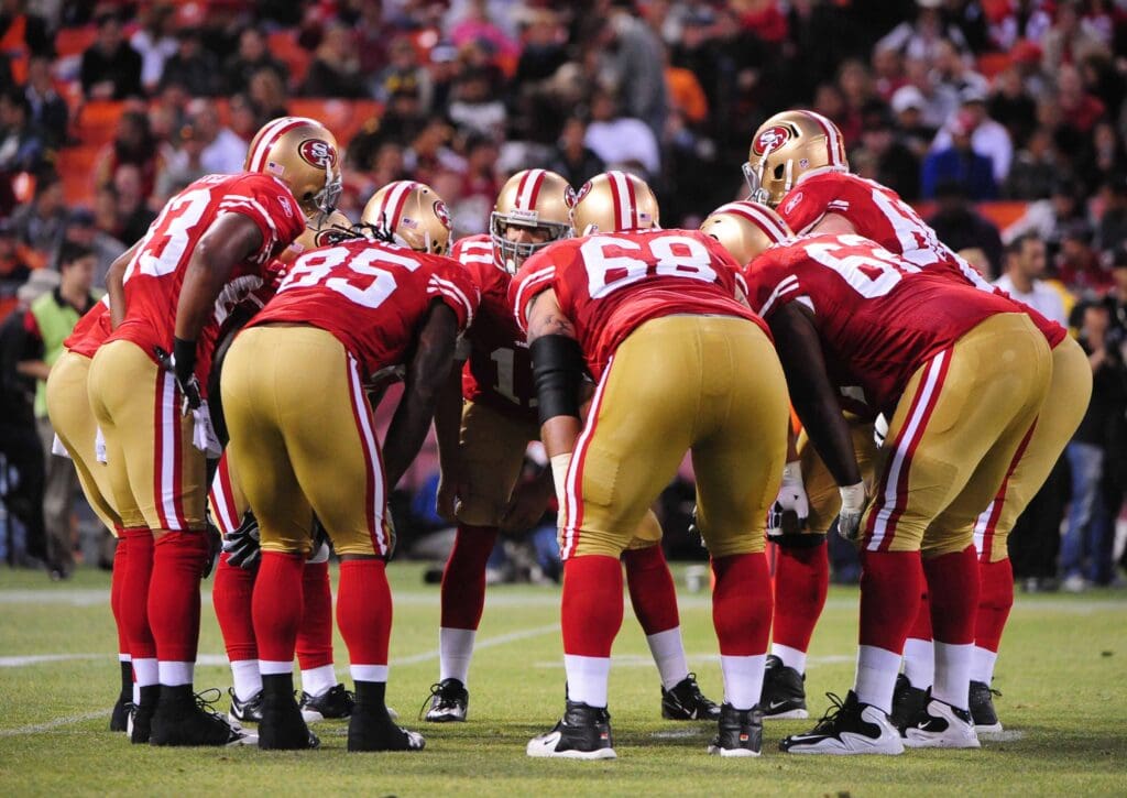 August 14, 2009; San Francisco, CA, USA; San Francisco 49ers quarterback Alex Smith (11) instructs his team in a huddle during the game against the Denver Broncos at Candlestick Park. The 49ers defeated the Broncos 17-16.