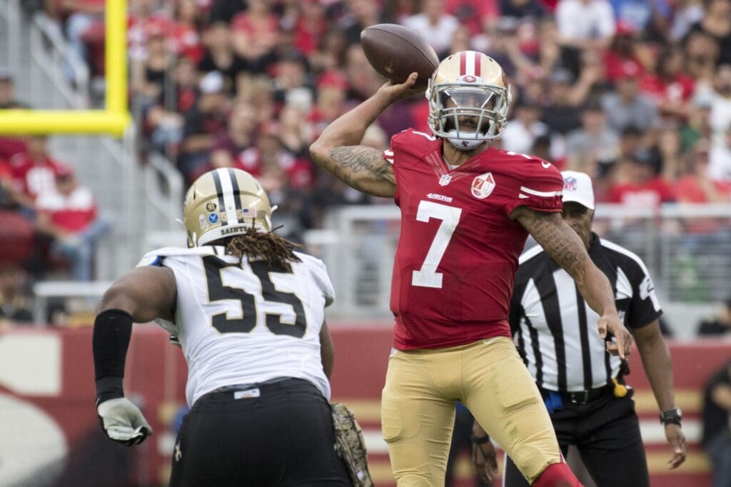 November 6, 2016; Santa Clara, CA, USA; San Francisco 49ers quarterback Colin Kaepernick (7) passes the football against New Orleans Saints defensive end Darryl Tapp (55) during the third quarter at Levi's Stadium. The Saints defeated the 49ers 41-23.