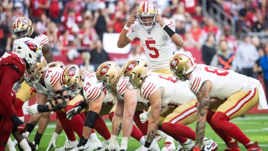 Jan 5, 2025; Glendale, Arizona, USA; San Francisco 49ers quarterback Joshua Dobbs (5) calls a play against the Arizona Cardinals in the first half at State Farm Stadium