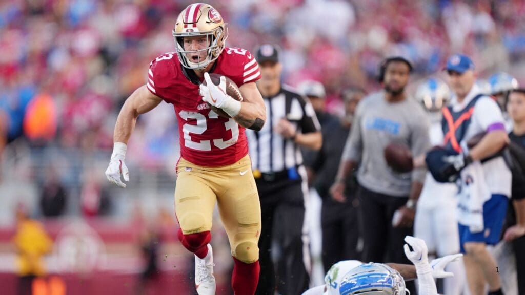 Jan 28, 2024; Santa Clara, California, USA; San Francisco 49ers running back Christian McCaffrey (23) runs with the ball against Detroit Lions safety C.J. Gardner-Johnson (2) during the first half of the NFC Championship football game at Levi's Stadium.