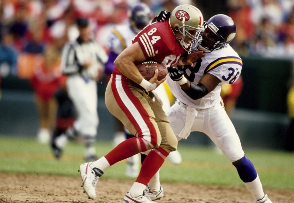 Oct 3, 1993; San Francisco, CA, USA; San Francisco 49ers tight end Brent Jones (84) and Minnesota Vikings defensive back Todd Scott (38) in action at Candlestick Park.