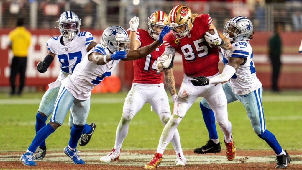 Oct 27, 2024; Santa Clara, California, USA; San Francisco 49ers tight end George Kittle (85) runs with the football against Dallas Cowboys safety Malik Hooker (28) during the second quarter at Levi's Stadium