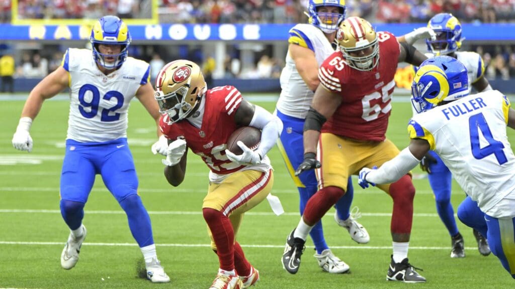 Sep 17, 2023; Inglewood, California, USA; San Francisco 49ers wide receiver Deebo Samuel (19) runs through the Los Angeles Rams defense for a touchdown in the second half at SoFi Stadium.