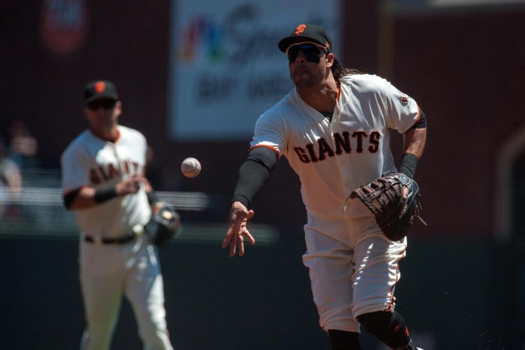 May 17, 2017; San Francisco, CA, USA; San Francisco Giants first baseman Michael Morse (38) tosses the ball to starting pitcher Johnny Cueto (47, not pictured) at first base during the first inning of the game against the Los Angeles Dodgers at AT&T Park.