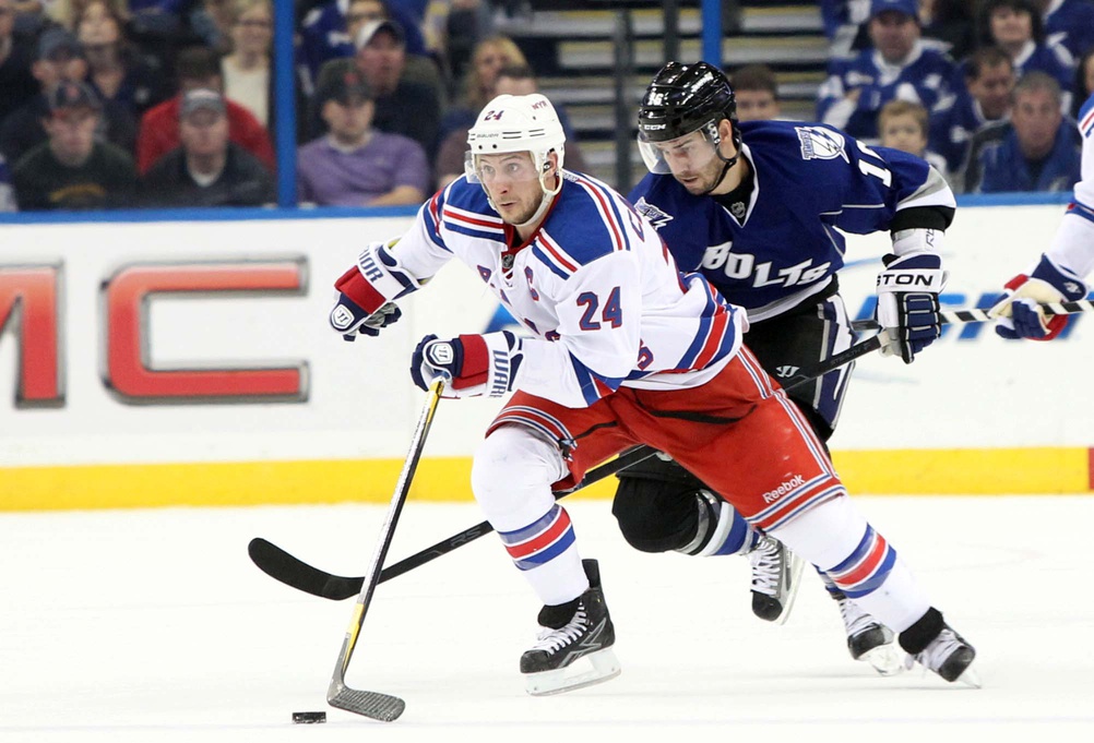 December 3, 2011; Tampa FL, USA; New York Rangers center Sean Avery (16) skates with the puck as Tampa Bay Lightning right wing Teddy Purcell (16) defends during the first period at St. Pete Times Forum.