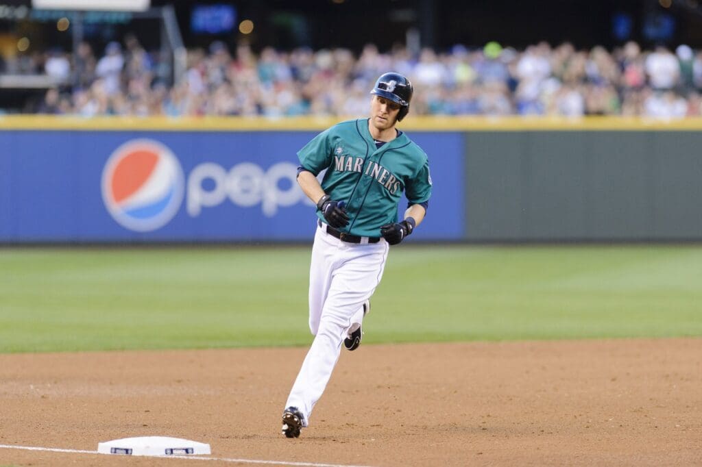 Jun 28, 2013; Seattle, WA, USA; Seattle Mariners left fielder Jason Bay (12) rounds 3rd base after hitting a solo home run against the Chicago Cubs during the 5th inning at Safeco Field.