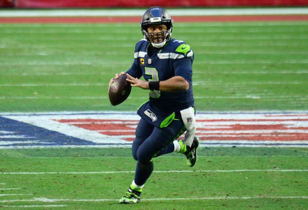 Jan 3, 2021; Glendale, Arizona, USA; Seattle Seahawks quarterback Russell Wilson (3) throws a pass against the San Francisco 49ers during the second half at State Farm Stadium.
