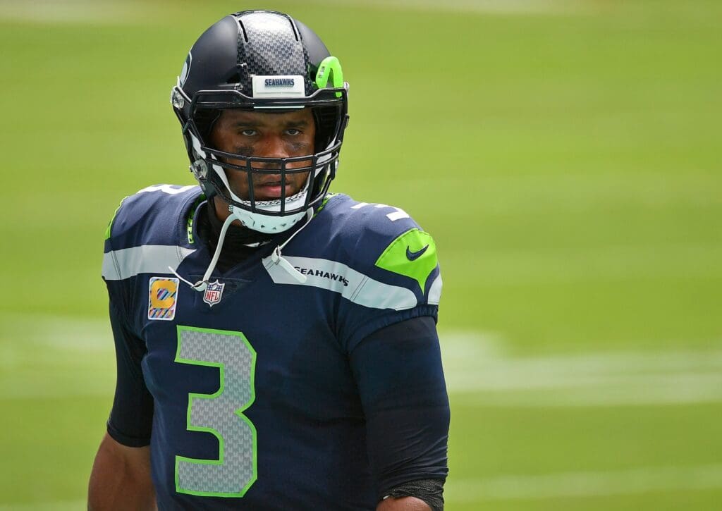 Oct 4, 2020; Miami Gardens, Florida, USA; Seattle Seahawks quarterback Russell Wilson (3) looks on from the bench area prior to the game against the Miami Dolphins at Hard Rock Stadium.