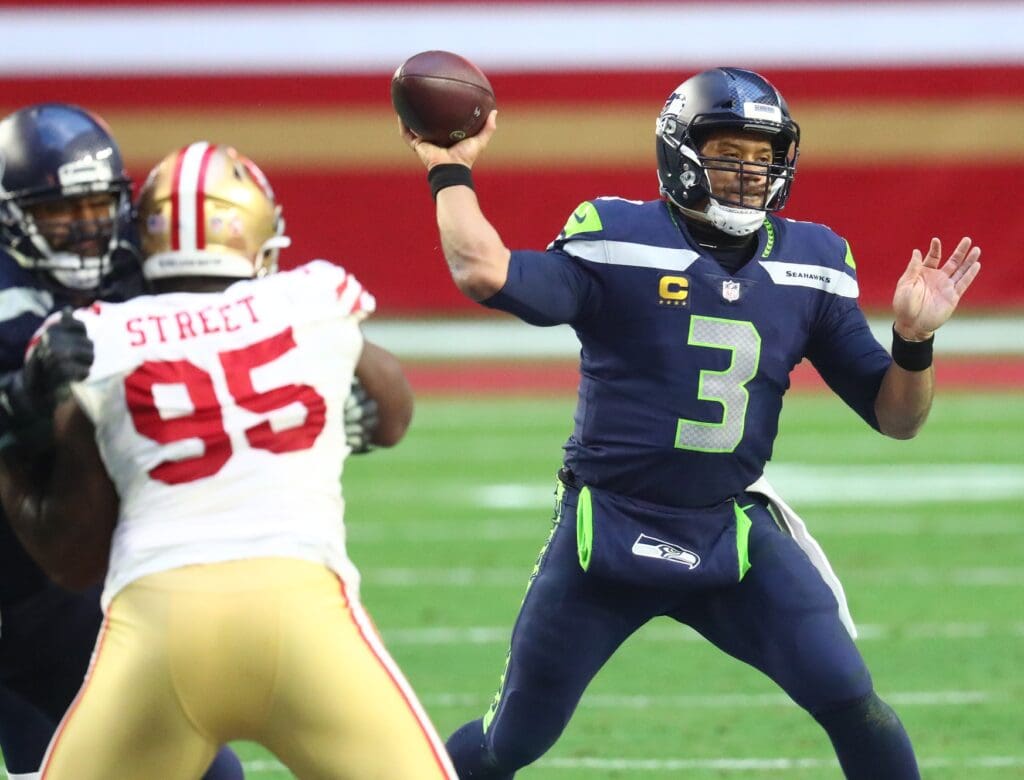 Jan 3, 2021; Glendale, Arizona, USA; Seattle Seahawks quarterback Russell Wilson (3) throws against the San Francisco 49ers during the second half at State Farm Stadium