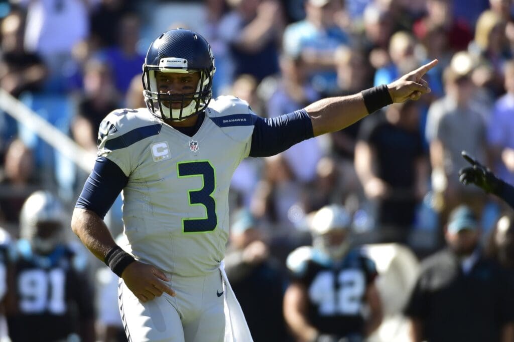 Oct 26, 2014; Charlotte, NC, USA; Seattle Seahawks quarterback Russell Wilson (3) signals in the second quarter at Bank of America Stadium.