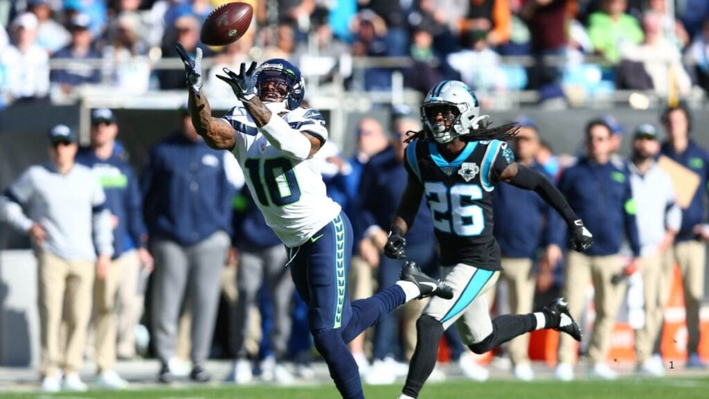 Dec 15, 2019; Charlotte, NC, USA; Seattle Seahawks wide receiver Josh Gordon (10) catches a pass against Carolina Panthers cornerback Donte Jackson (26) during the second quarter at Bank of America Stadium.