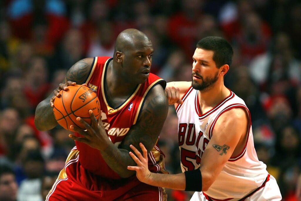 Apr 25, 2010; Chicago, IL, USA; Cleveland Cavaliers center Shaquille O'Neal (33) being defended by Chicago Bulls center Brad Miller (52) during the second quarter in game four of the first round of the 2010 NBA playoffs at the United Center.
