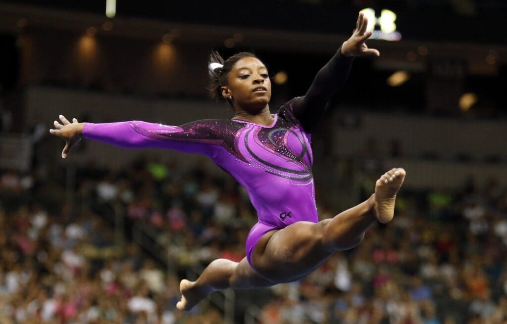 Aug 23, 2014; Pittsburgh, PA, USA; Simone Biles competes on the floor exercise portion at the 2014 P&G Championships at the CONSOL Energy Center.
