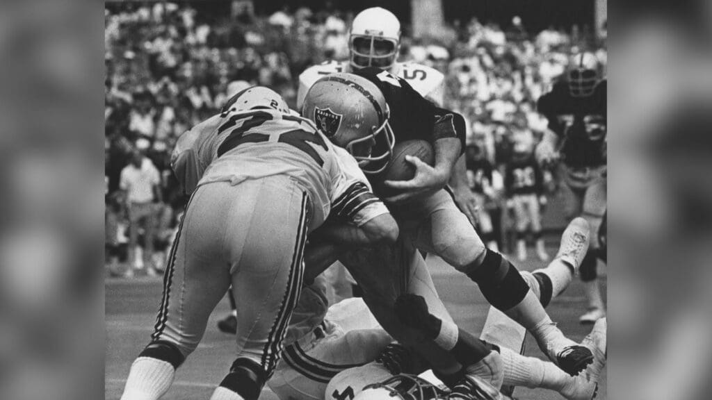 Oct 7, 1973; St. Louis, MO, USA; FILE PHOTO; Oakland Raiders full back Marv Hubbard (44) carries the ball against St. Louis Cardinals cornerback Roger Wehrli (22) at Busch Stadium.