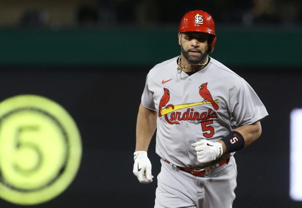 Oct 3, 2022; Pittsburgh, Pennsylvania, USA; St. Louis Cardinals designated hitter Albert Pujols (5) rounds the bases on a two run home run against the Pittsburgh Pirates during the sixth inning at PNC Park. The home run was the 703rd of Pujols career and the two runs batted in moved him into second place on the all-time MLB RBI list with 2216 runs batted in.