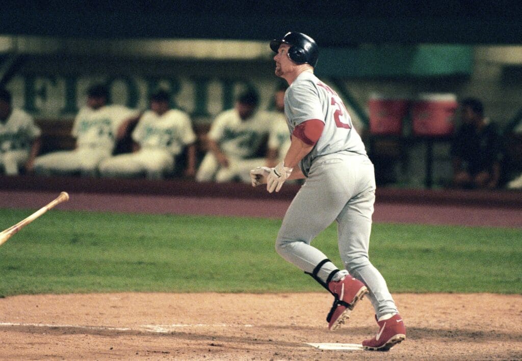 Sep 1, 1998; Miami, FL, USA: FILE PHOTO; St. Louis Cardinals infielder Mark McGwire hits his 57th homerun of the 1998 season against the Florida Marlins at Dolphin Stadium.