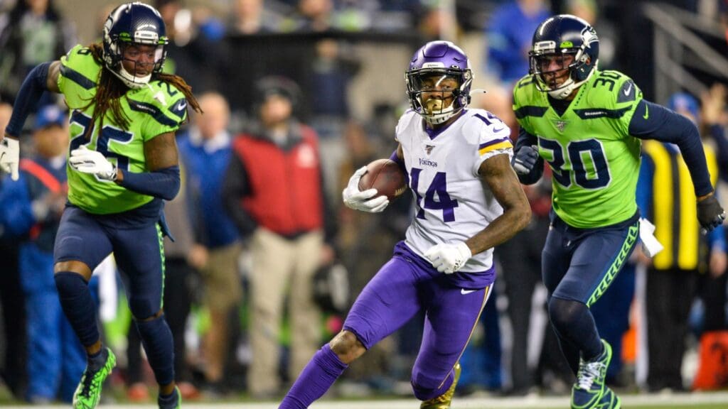 Dec 2, 2019; Seattle, WA, USA; Minnesota Vikings wide receiver Stefon Diggs (14) carries the ball after a catch against the Seattle Seahawks during the first half at CenturyLink Field.