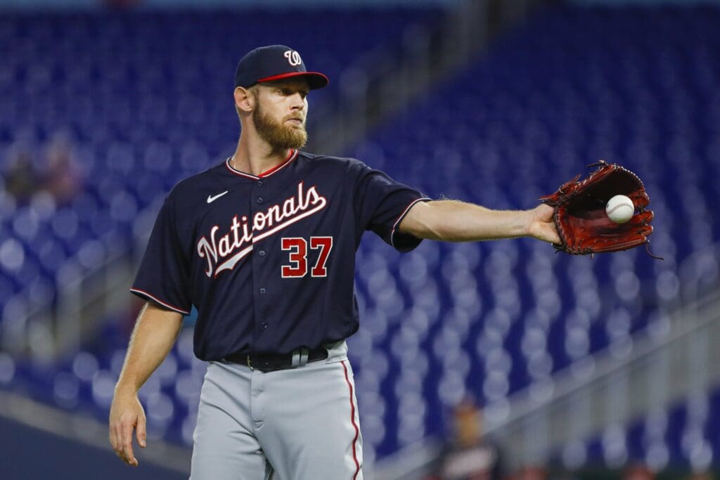 Jun 9, 2022; Miami, Florida, USA; Washington Nationals starting pitcher Stephen Strasburg (37) catches a baseball during the first inning against the Miami Marlins at loanDepot Park.
