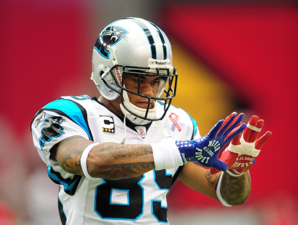 Sept. 11, 2011; Glendale, AZ, USA; Carolina Panthers wide receiver Steve Smith shows off his gloves that pay tribute to the memory of the attacks of September 11th, 2001 prior to the game against the Arizona Cardinals at University of Phoenix Stadium.