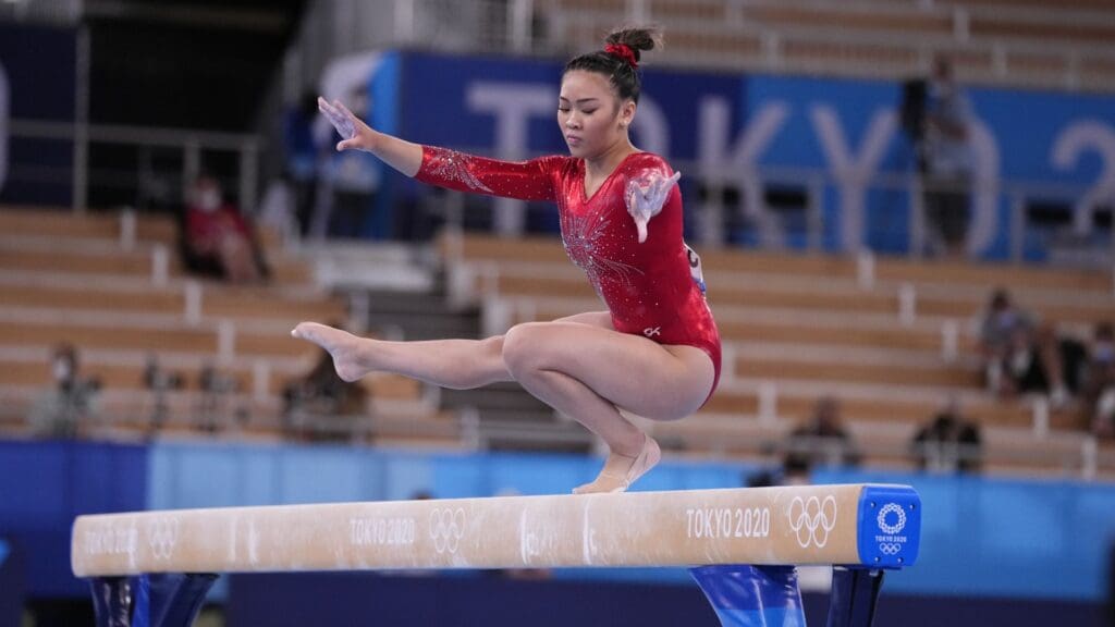 Aug 3, 2021; Tokyo, Japan; Sunisa Lee (USA) competes on the women's balance beam during the Tokyo 2020 Olympic Summer Games at Ariake Gymnastics Centre.