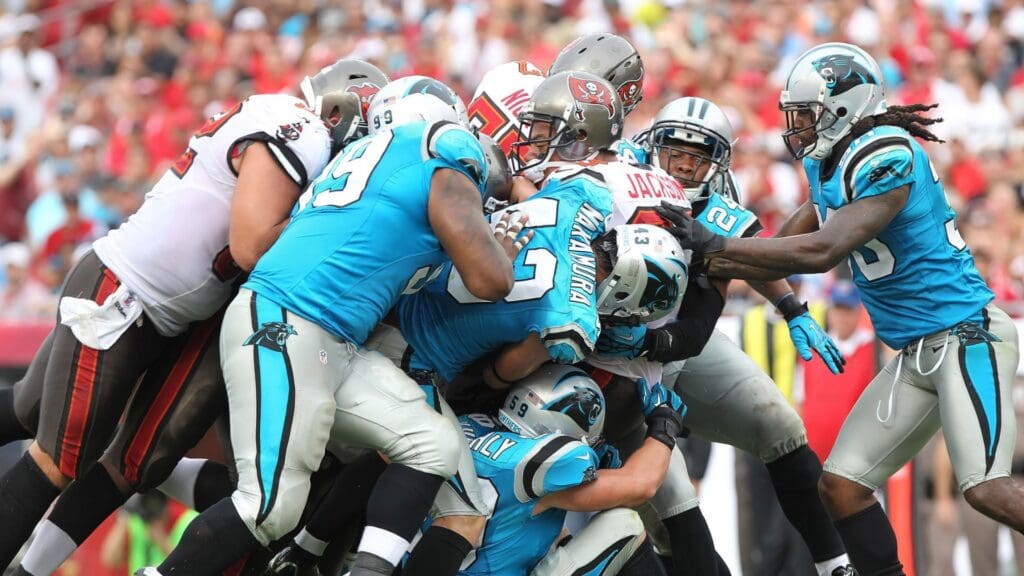 September 9, 2012; Tampa, FL, USA; Tampa Bay Buccaneers wide receiver Vincent Jackson (83) runs with the ball and gets pushed closer to the end zone in the second quarter against the Carolina Panthers at Raymond James Stadium.