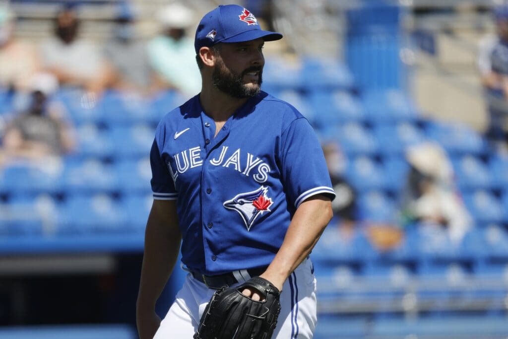 Mar 11, 2021; Dunedin, Florida, USA; Toronto Blue Jays starting pitcher Tanner Roark (14) looks on during the first inning against the Detroit Tigers during spring training at TD Ballpark
