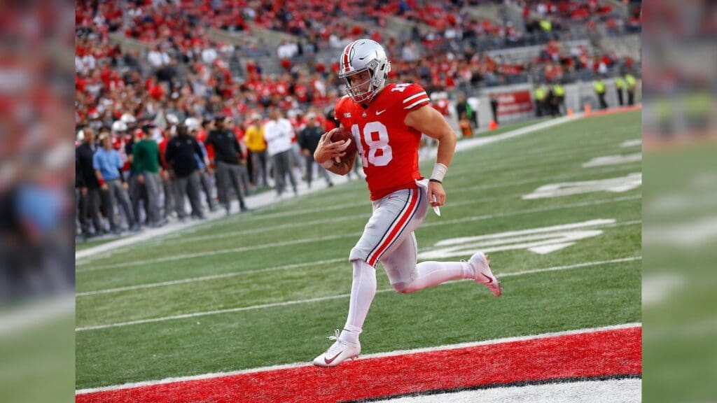 Sep 22, 2018; Columbus, OH, USA; Ohio State Buckeyes quarterback Tate Martell (18) scores a running touchdown during the fourth quarter against the Tulane Green Wave at Ohio Stadium.