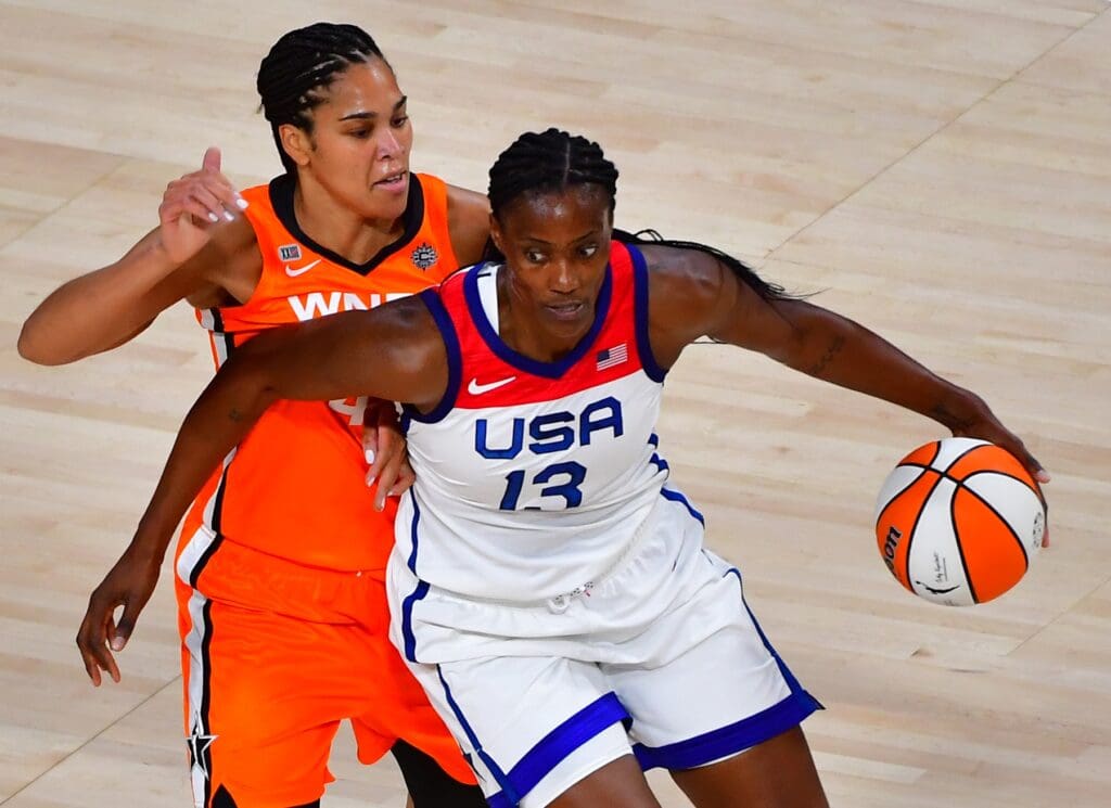 Jul 14, 2021; Las Vegas, NV, USA; Team USA center Sylvia Fowles (13) dribbles around WNBA All Star forward Brionna Jones (42) during the WNBA All Star Game at Michelob Ultra Arena at Mandalay Bay Resort.