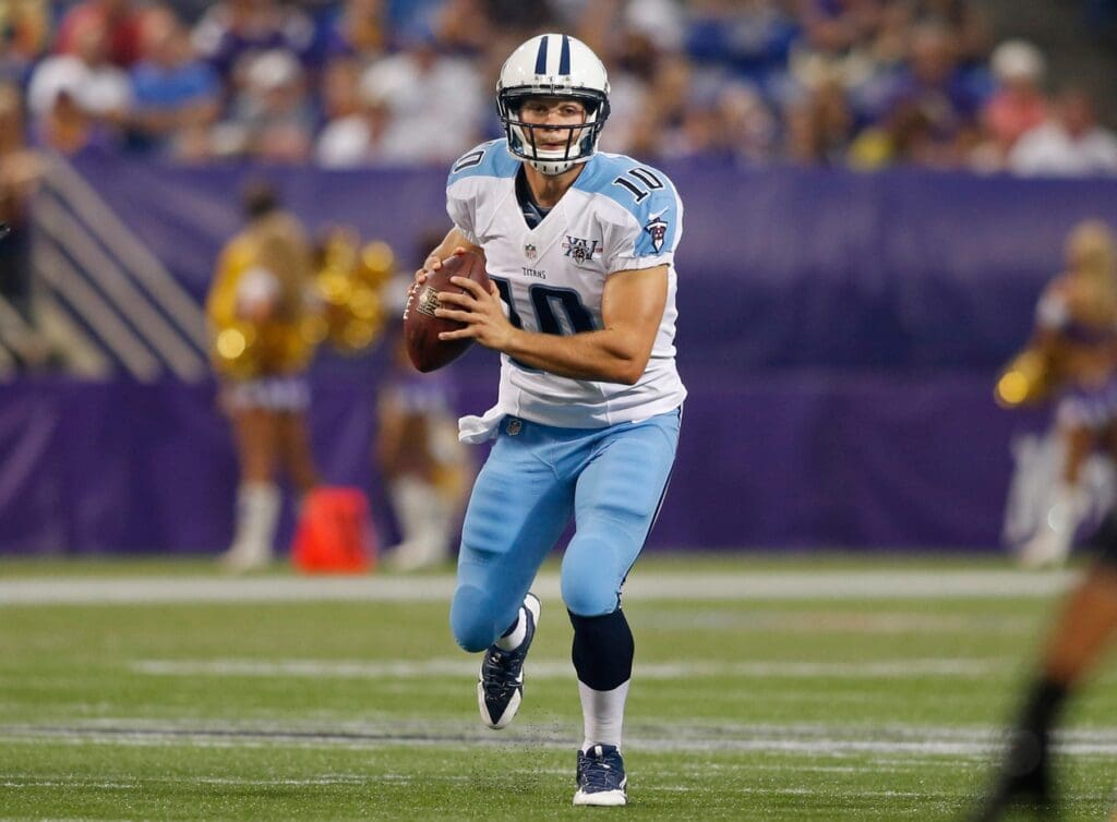 Aug 29, 2013; Minneapolis, MN, USA; Tennessee Titans quarterback Jake Locker (10) scrambles against the Minnesota Vikings in the first quarter at Mall of America Field at H.H.H. Metrodome. The Vikings won 24-23.