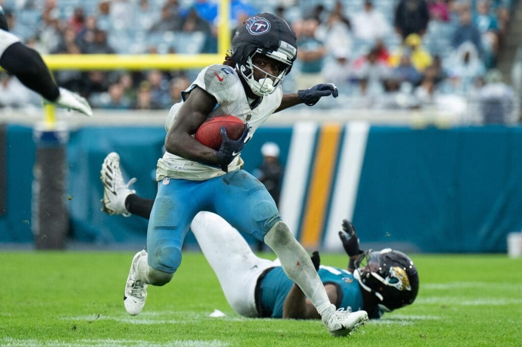 Dec 29, 2024; Jacksonville, Florida, USA; Tennessee Titans running back Tyjae Spears (2) runs the ball against the Jacksonville Jaguars in the third quarter at EverBank Stadium.