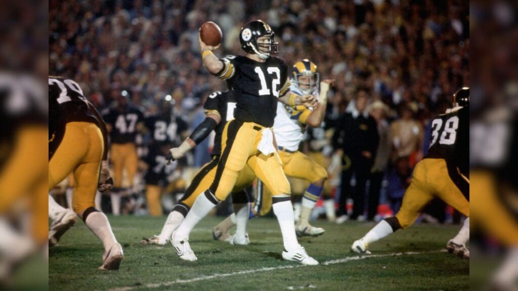 Jan 20, 1980; Pasadena, CA, USA; FILE PHOTO; Pittsburgh Steelers quarterback #12 Terry Bradshaw sets to throw a pass against the Los Angeles Rams during Super Bowl XIV at the Rose Bowl. The Steelers defeated the Rams 31-19. Bradshaw was named the games most valuable player as he was 14 of 21 passing for 309 yards and the Steelers became the first team to win 4 Super Bowls.