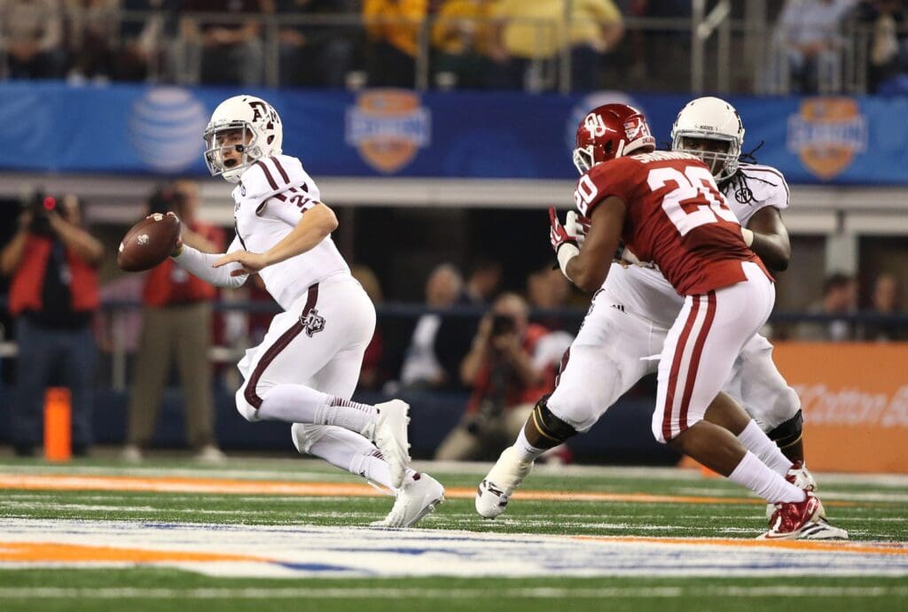 Jan 4, 2013; Arlington, TX, USA; Texas A&M Aggies quarterback Johnny Manziel (2) scrambles against the Oklahoma Sooners during the 2013 Cotton Bowl at Cowboys Stadium.