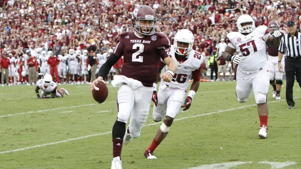 Sep 29, 2012; College Station, TX, USA; Texas A&M Aggies quarterback Johnny Manziel (2) runs the ball for a touchdown against the Arkansas Razorbacks in the fourth quarter at Kyle Field. Texas A&M defeated Arkansas 58-10.
