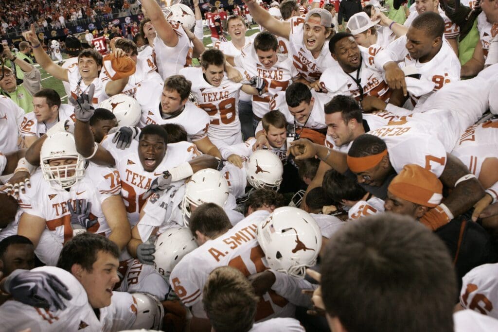 Dec 5, 2009; Arlington, TX, USA; Texas Longhorns celebrate a last second victory against the Nebraska Cornhuskers in the fourth quarter of the 2009 Big 12 championship game at Cowboys Stadium. Texas defeated Nebraska 13-12.