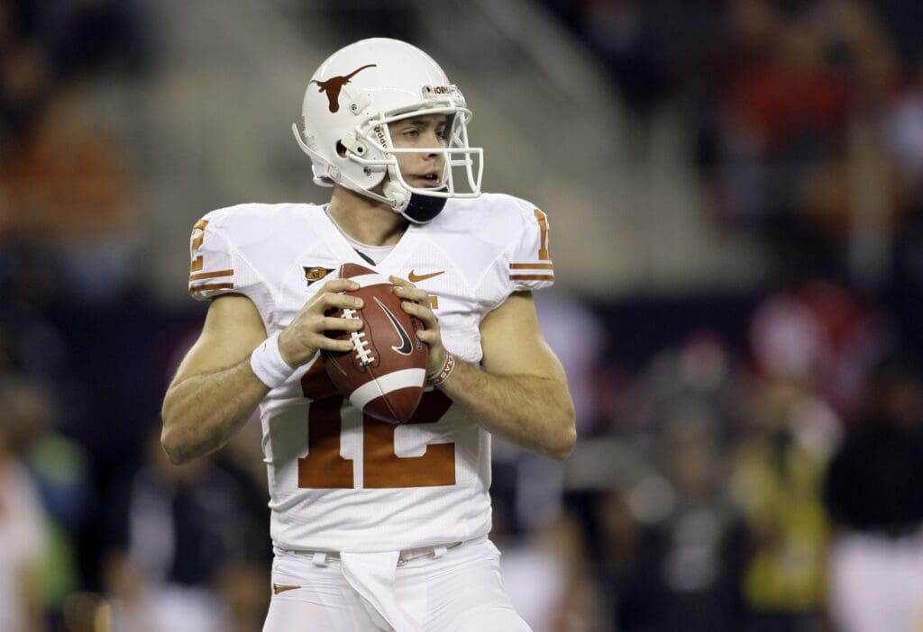 Dec 5, 2009; Arlington, TX, USA; Texas Longhorns quarterback Colt McCoy (12) drops back to pass against the Nebraska Cornhuskers in the first quarter of the 2009 Big 12 championship game at Cowboys Stadium