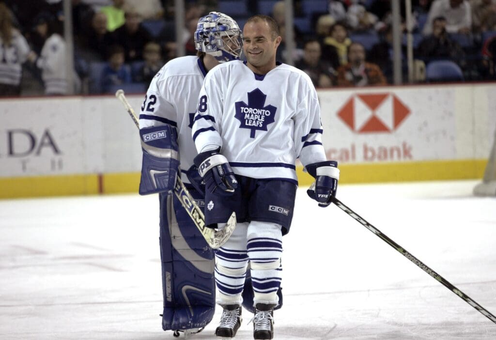 Nov 11, 2005; Buffalo, NY, USA; Toronto Maple Leafs right wing Tie Domi (28) and goalie Mikael Tellqvist (32) on the ice against the Buffalo Sabres at HSBC Arena.